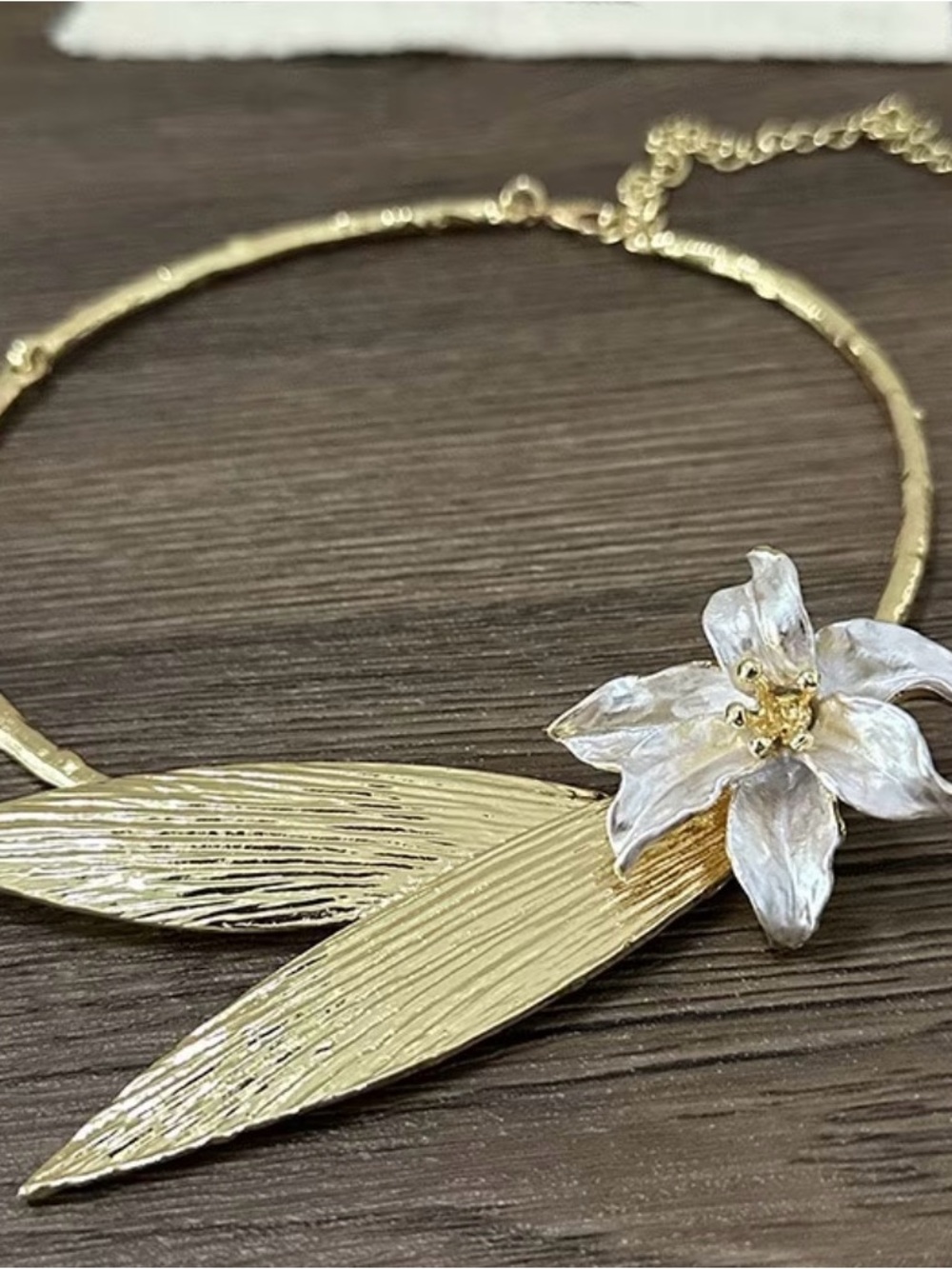 Anthropologie Gold Leaf Necklace with White Flower Accent